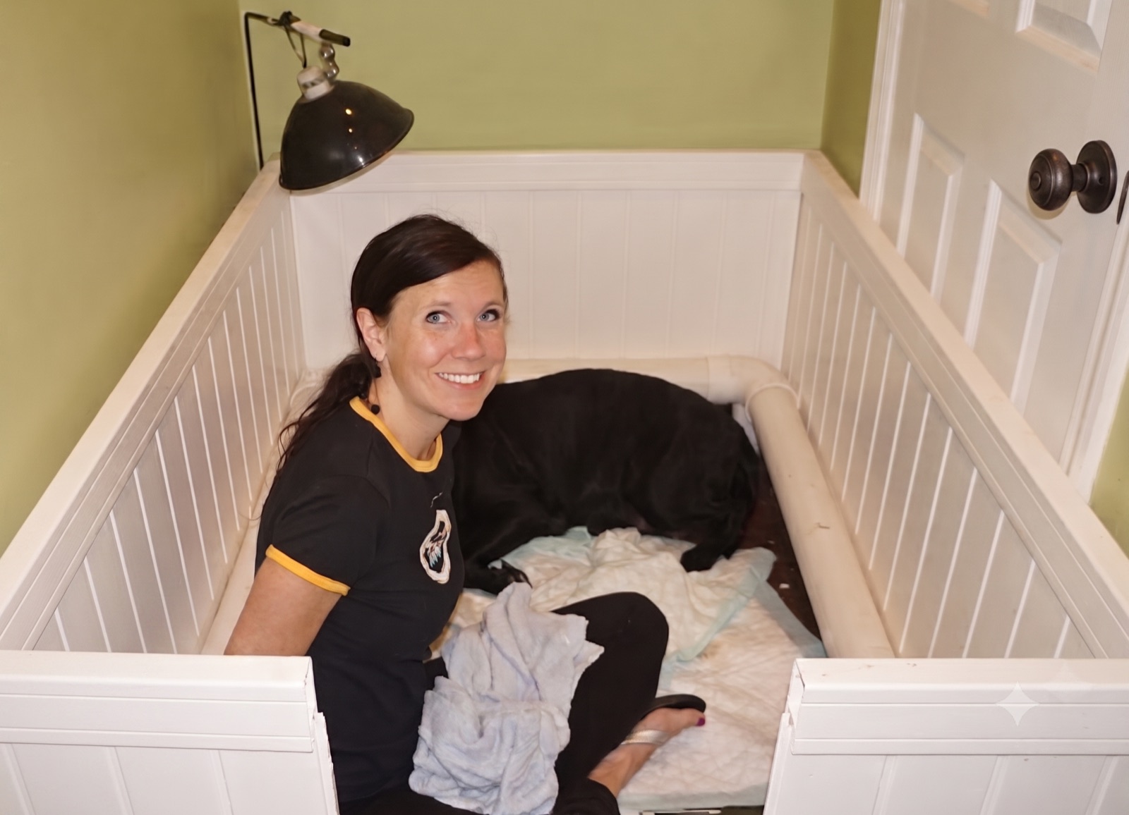 Joy Smith caring for a Kingridge Labrador puppy